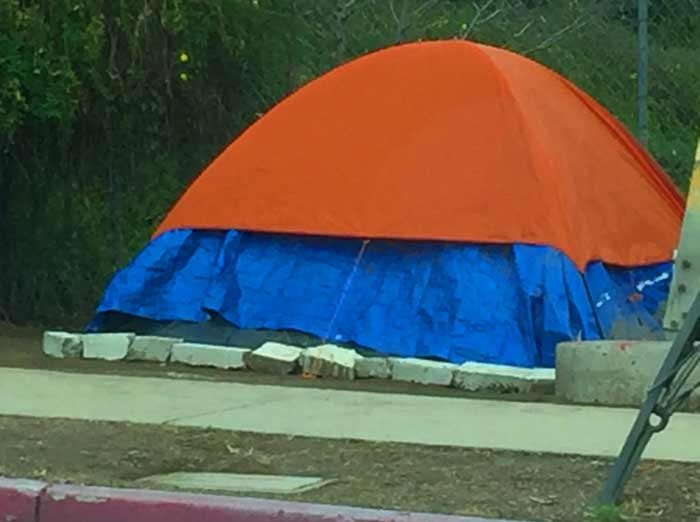 tent next to sidewalk